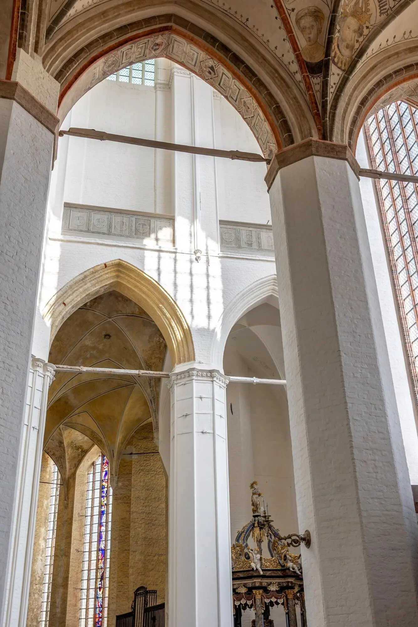 Antique facade with heraldic decoration in a golden Baroque style.